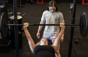 Strength training when injured over 40 — woman training at Block Fitness in Tucson